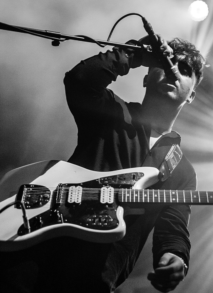Live performance with guitar and microphone